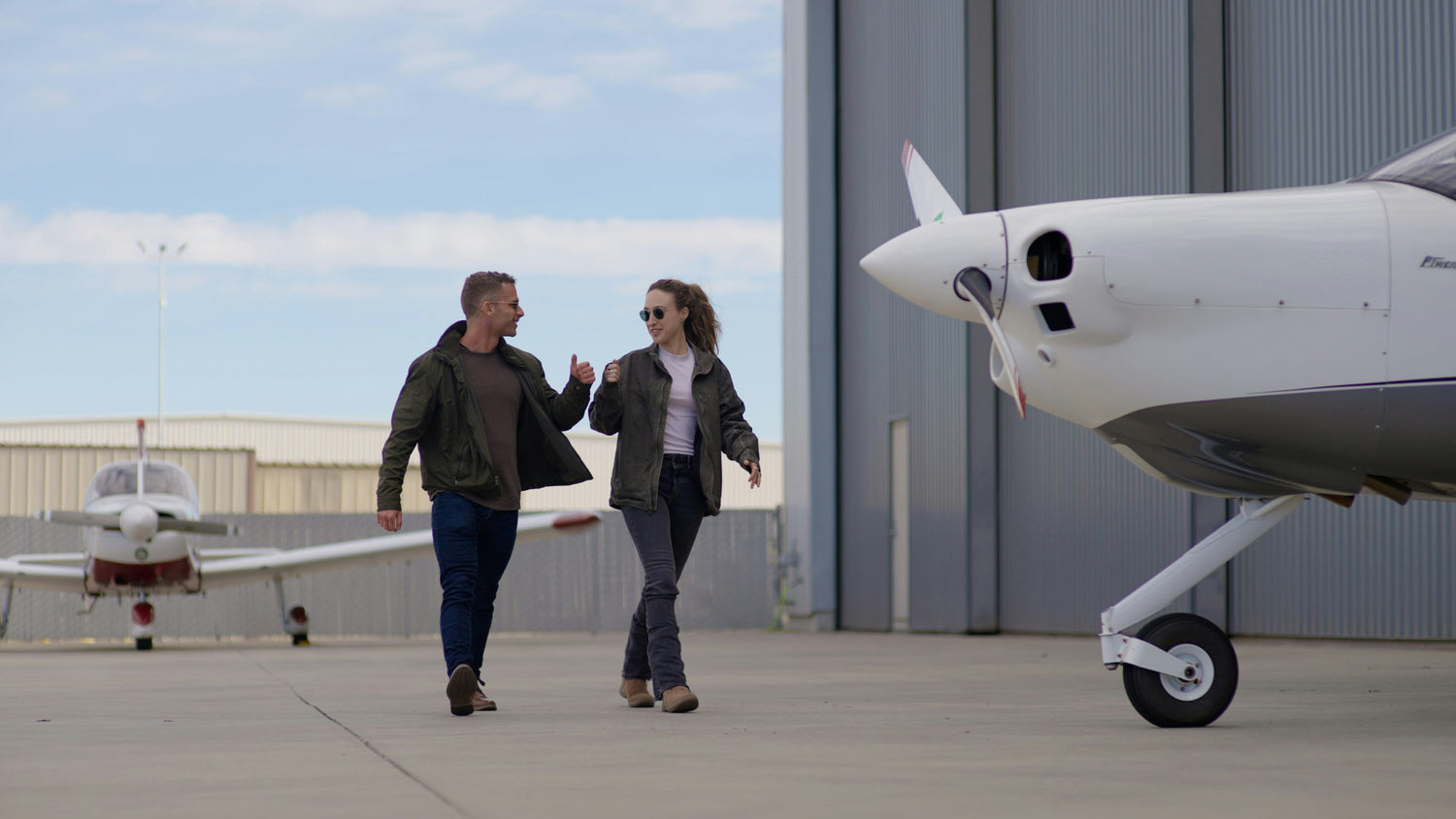 Student pilot with CFI, reviewing flight training materials and headset before first flight lesson