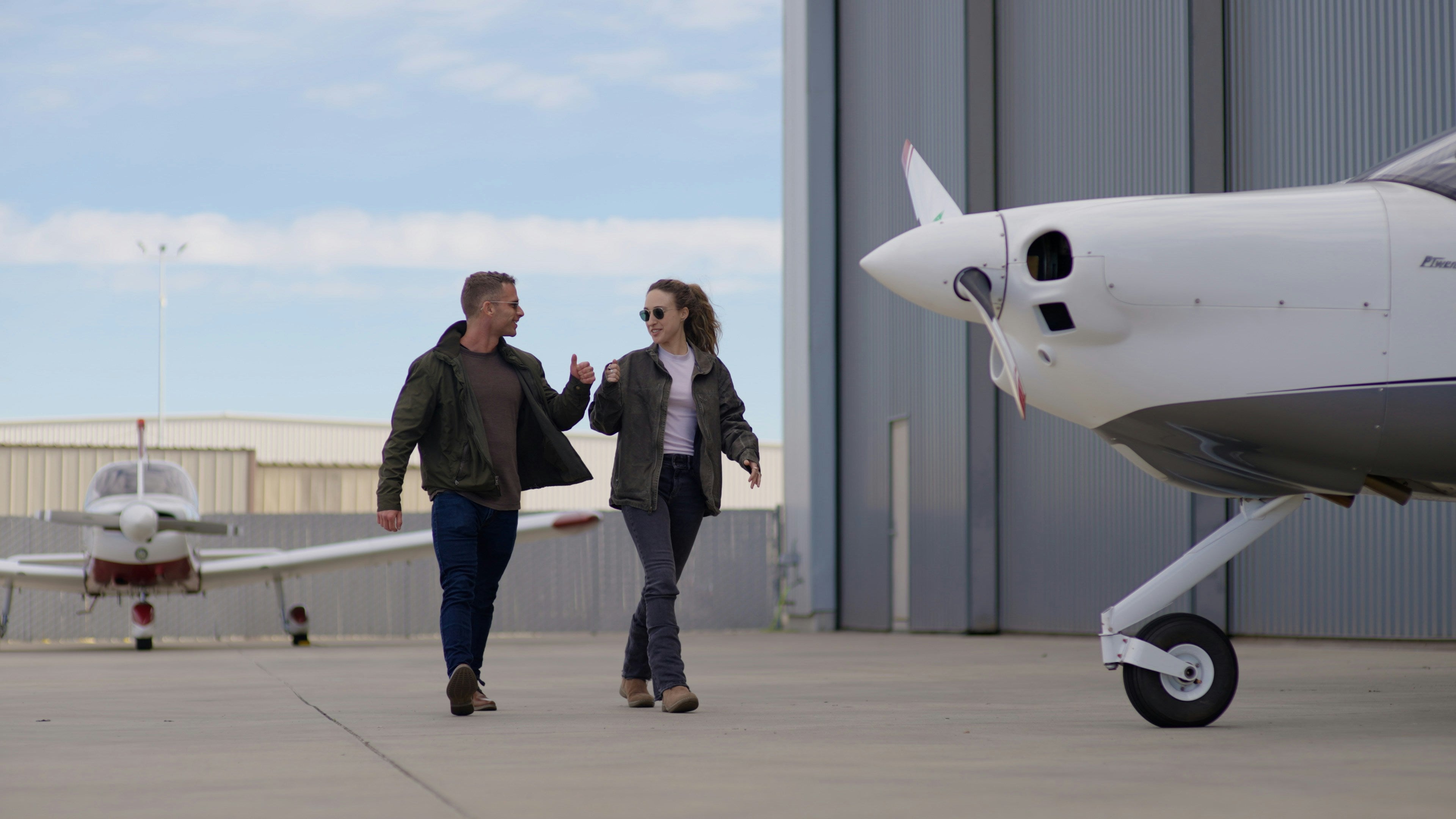 Student pilot with CFI, reviewing flight training materials and headset before first flight lesson